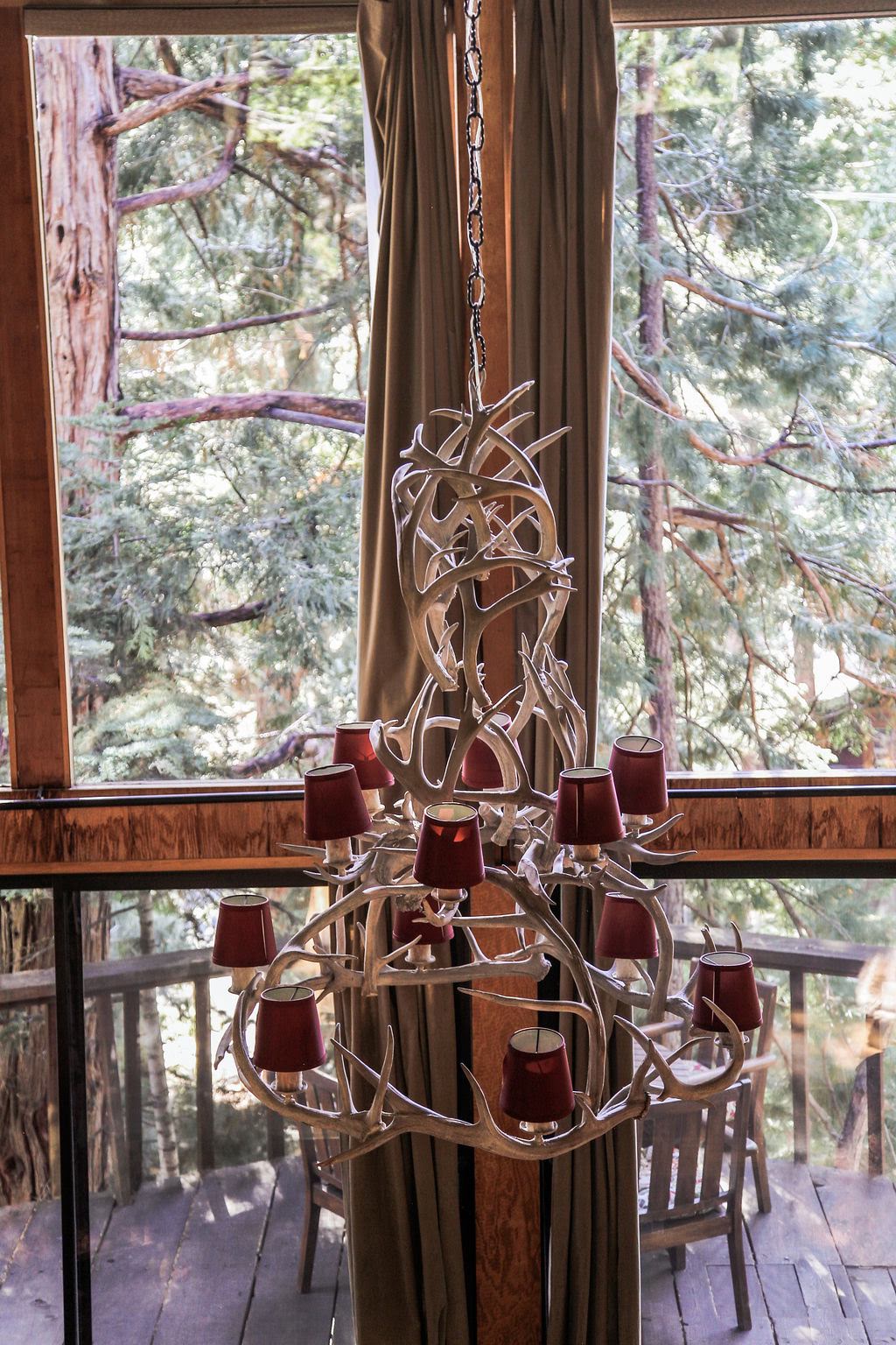 Gorgeous antler chandelier above the dining room table.-Original