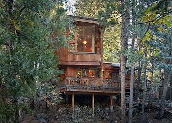 Spectacular rear view of deck and master bedroom from the creek 