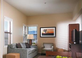 One bedroom villa living room with flat screen TV & seating for 