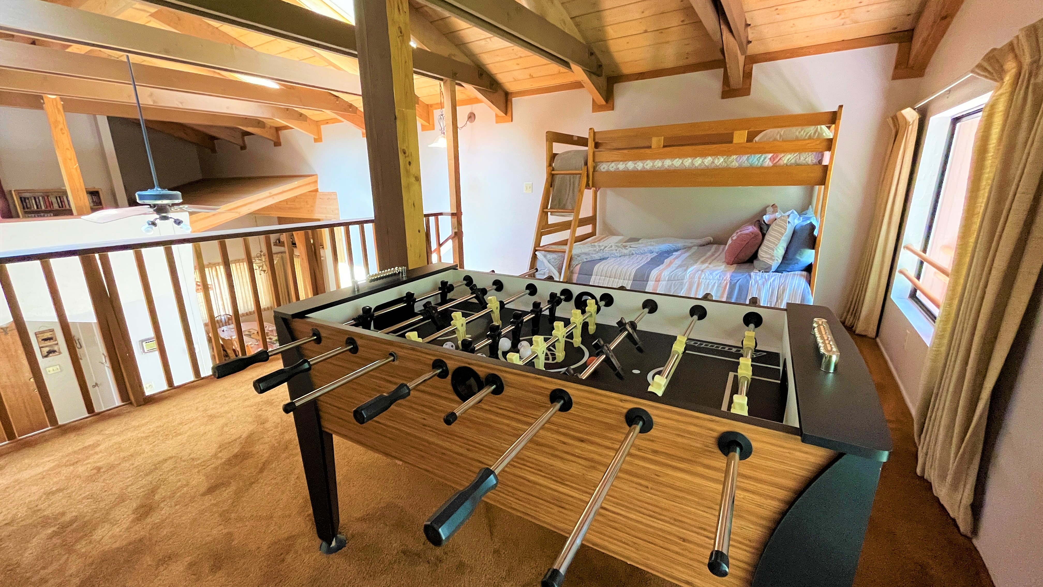 Upstairs loft featuring a bunk bed and a foosball table—perfect -Original