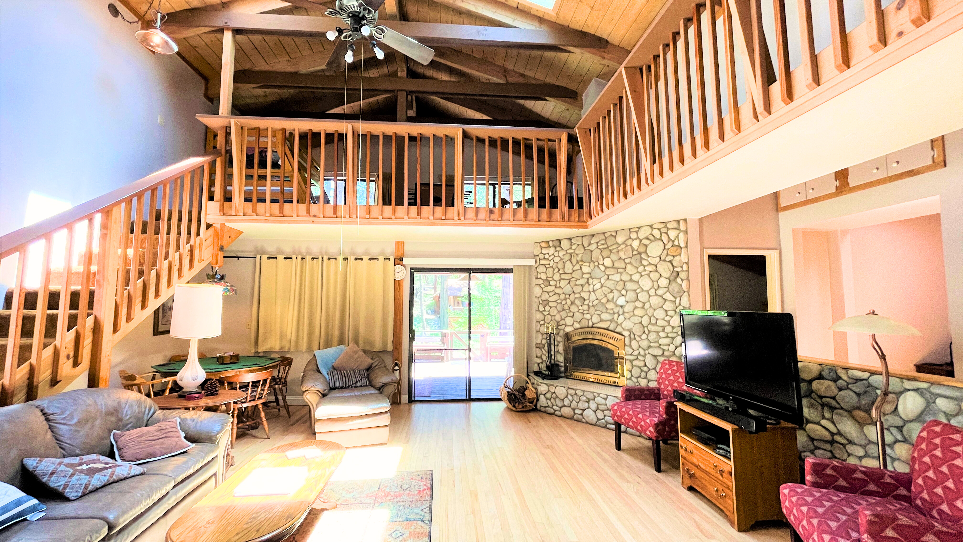 Living area featuring a TV, easy access to the outdoor deck, and-Original