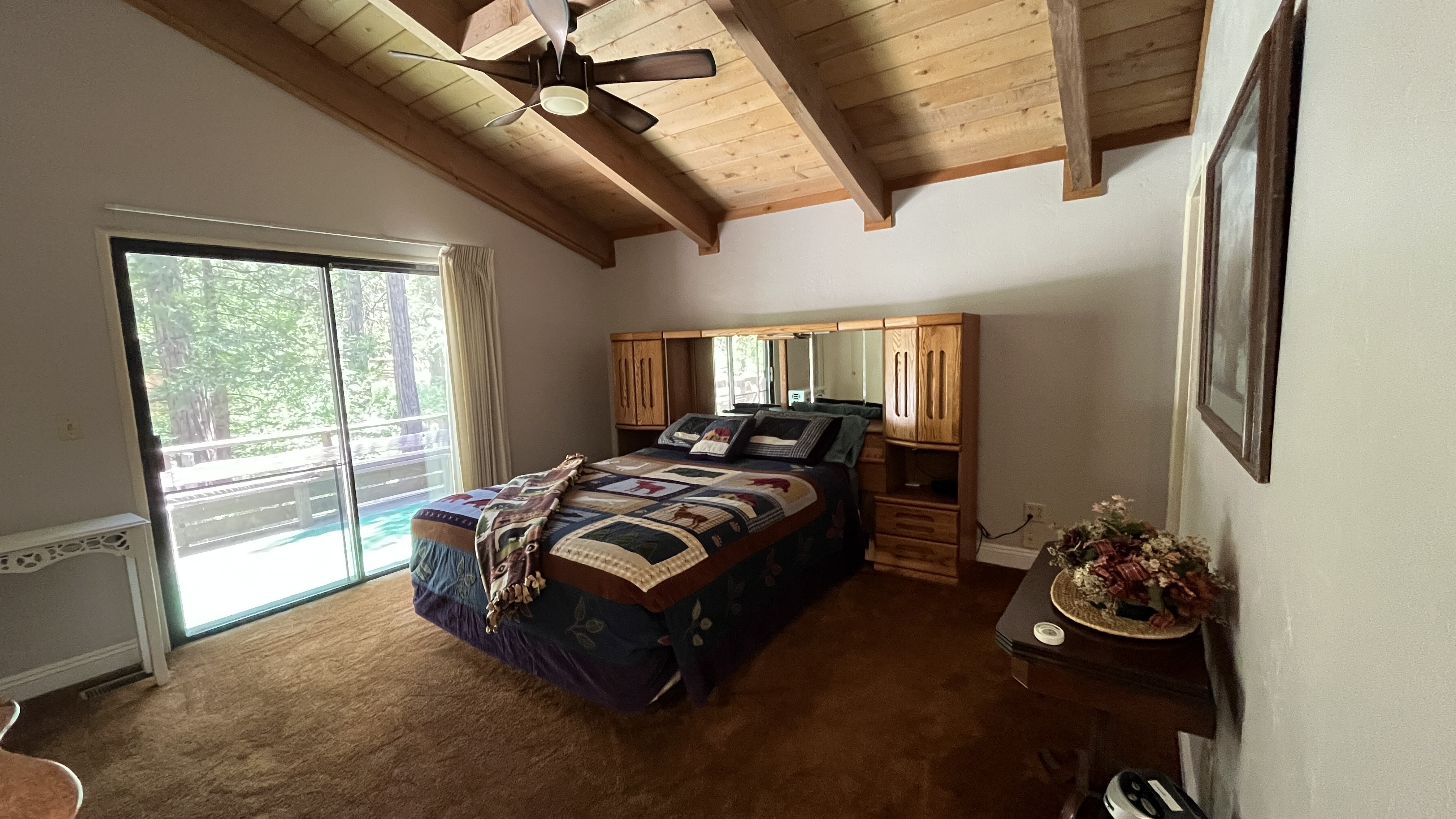 Primary bedroom with in suite bathroom and queen sized bed.-Original