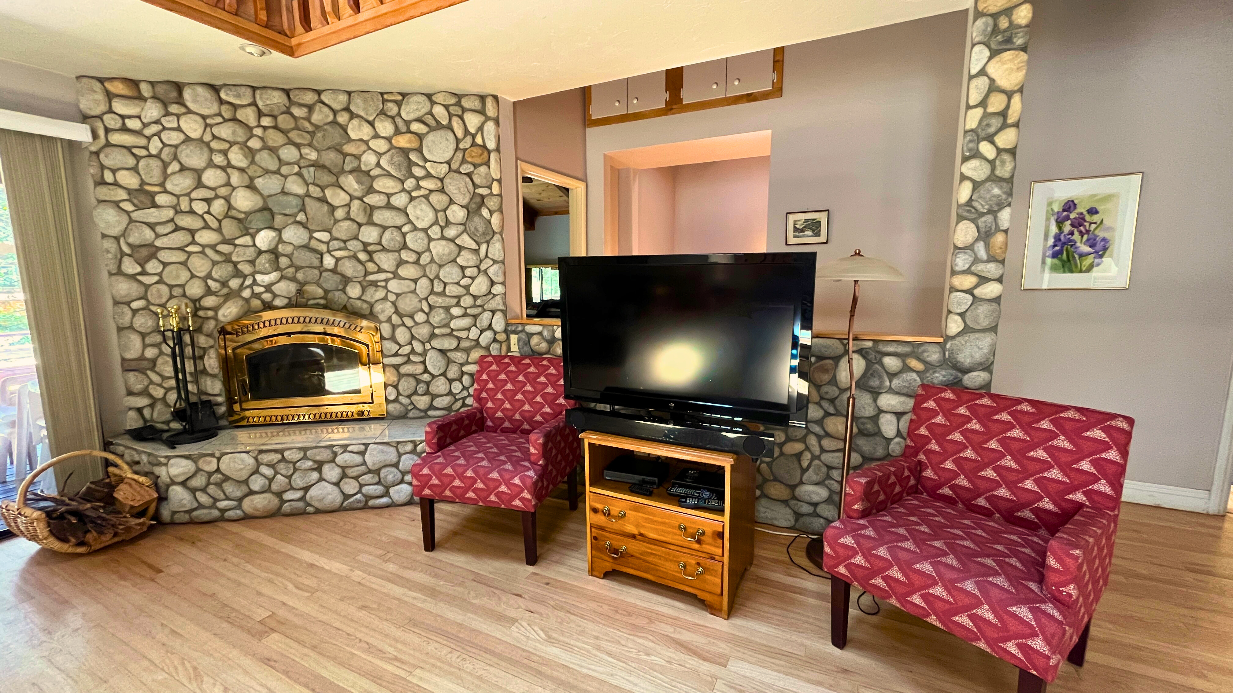 Cozy up by the river rock fireplace and watch your favorite movi-Original