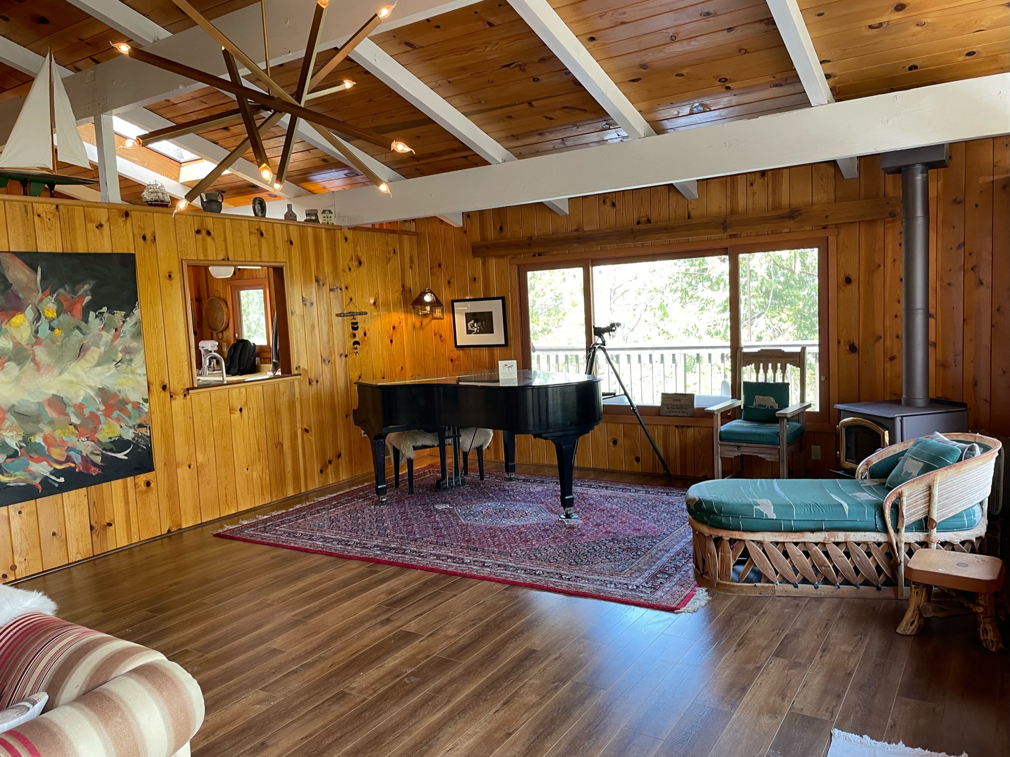 Grand piano in the front room gives cabin an elegant flair.-Original