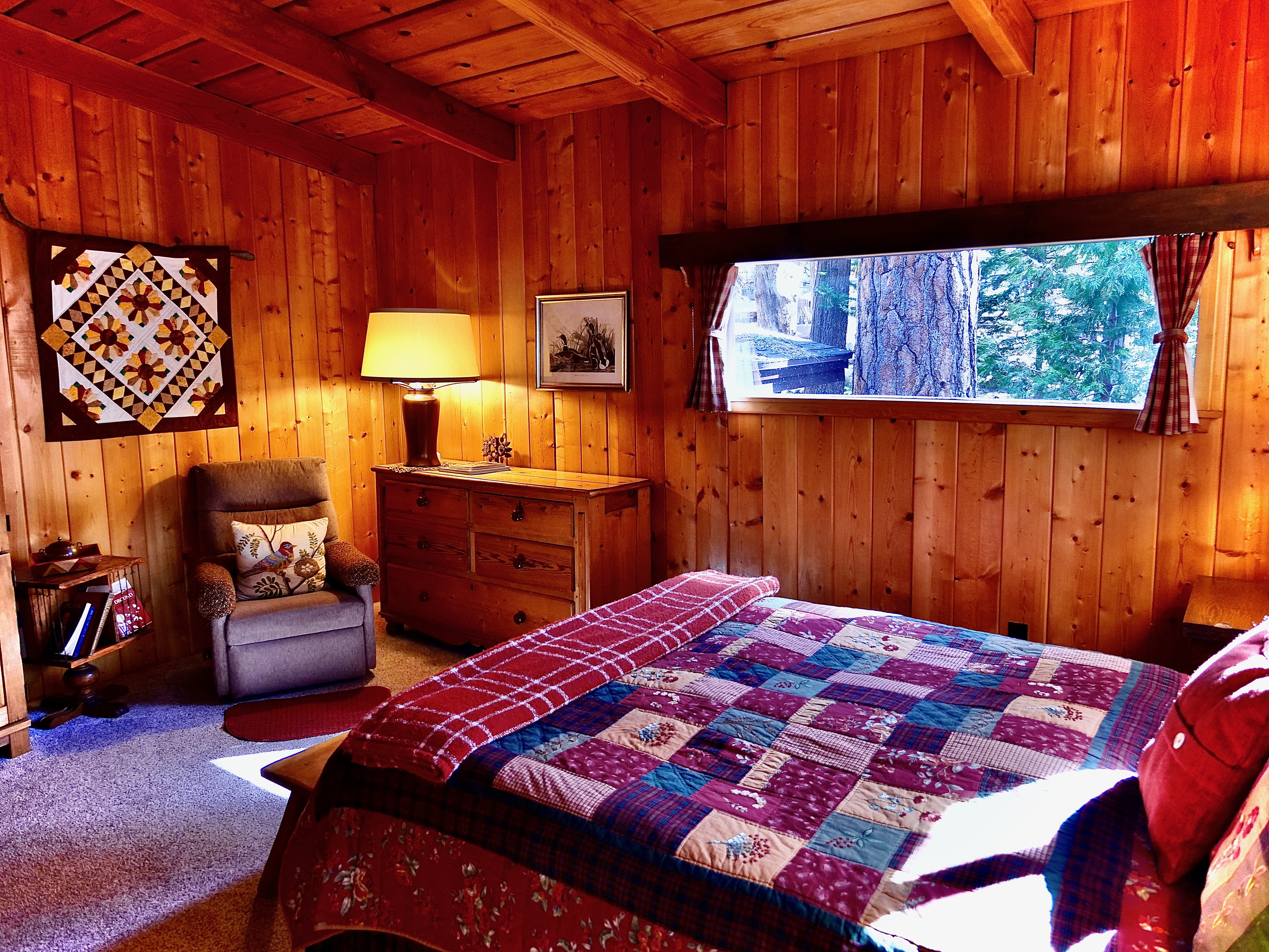 Cozy reading area and Smart TV in this bedroom.-Original