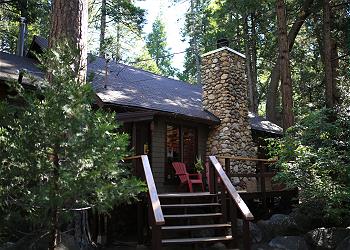 Front of cabin with welcoming porch.