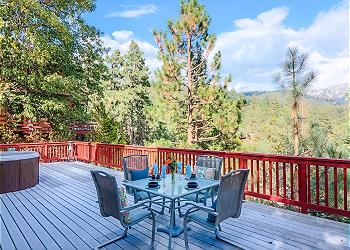 Large spacious deck with outdoor dining and spa.