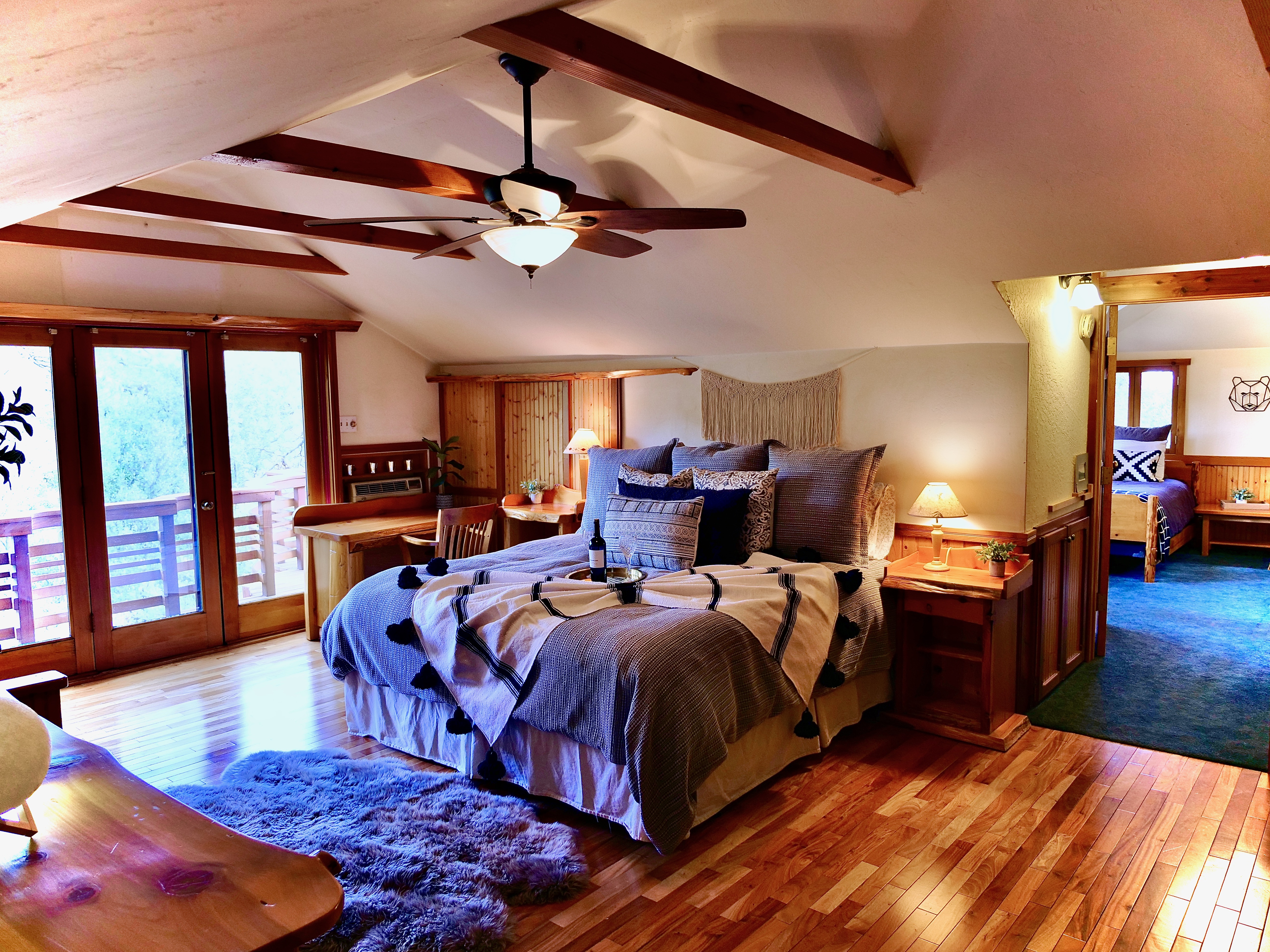 Master bedroom with private deck and fireplace.-Original