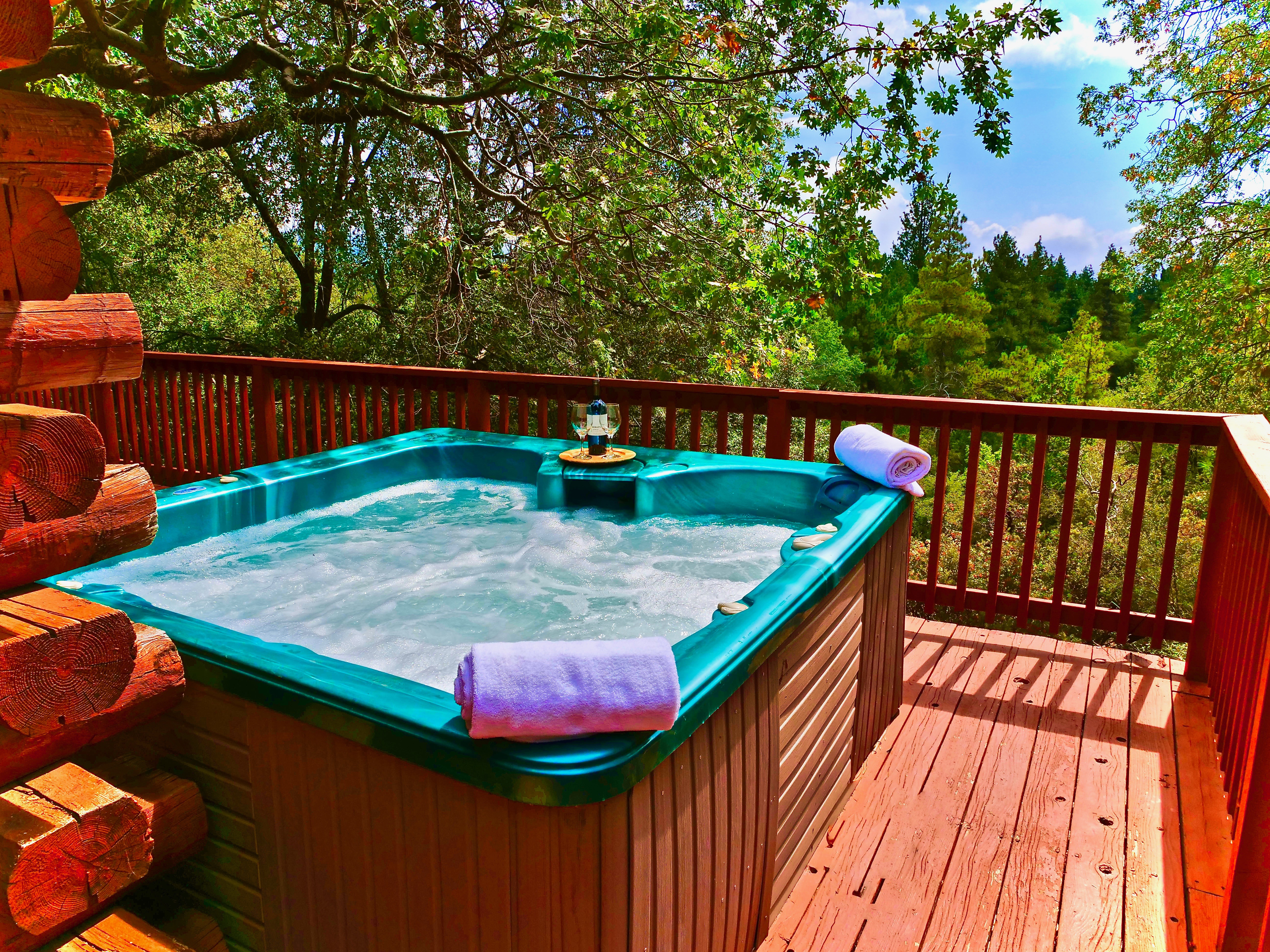 Soak in the hot tub and enjoy the beautiful mountain views.-Original