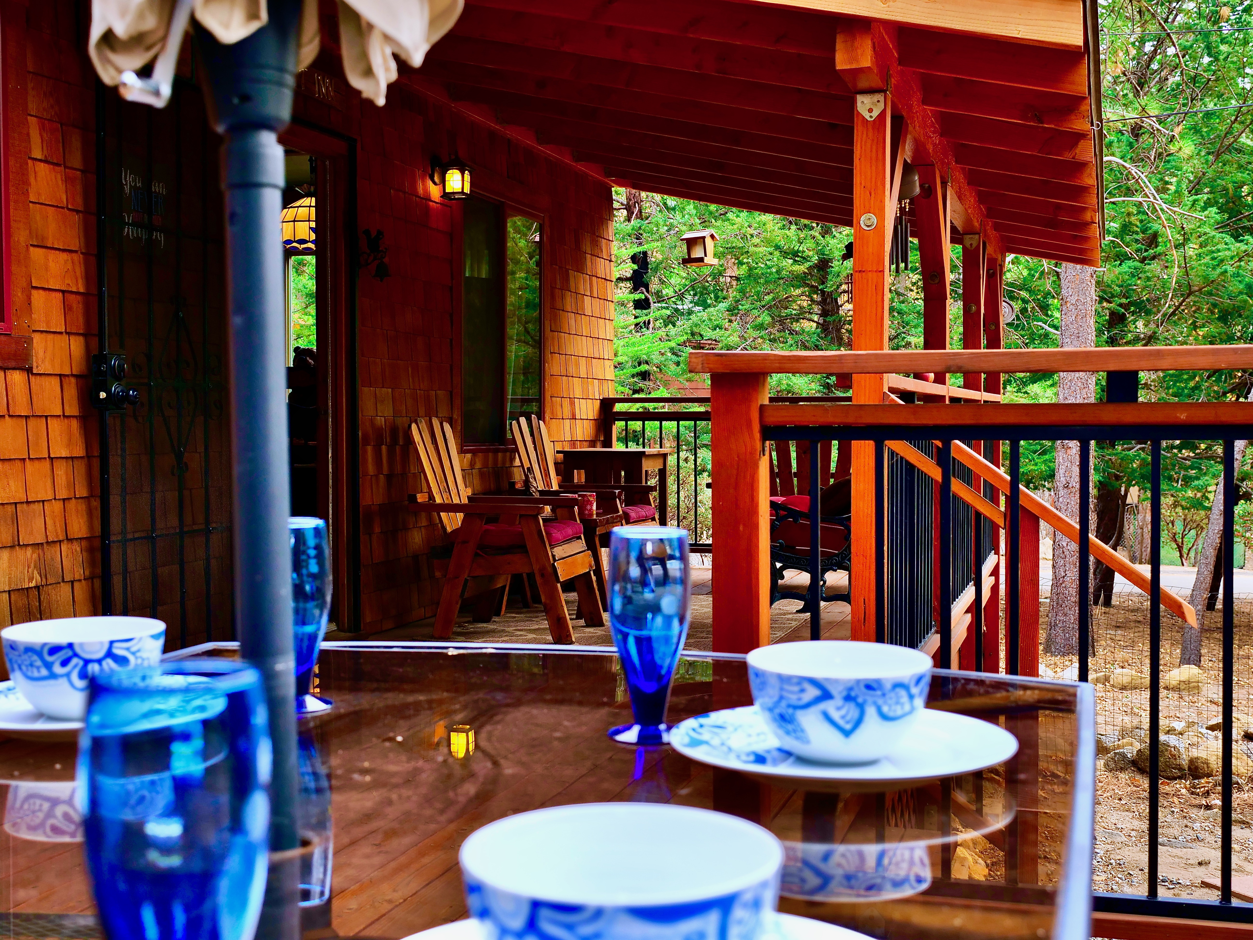 Enjoy dinner al fresco amongst the tall pine trees.-Original