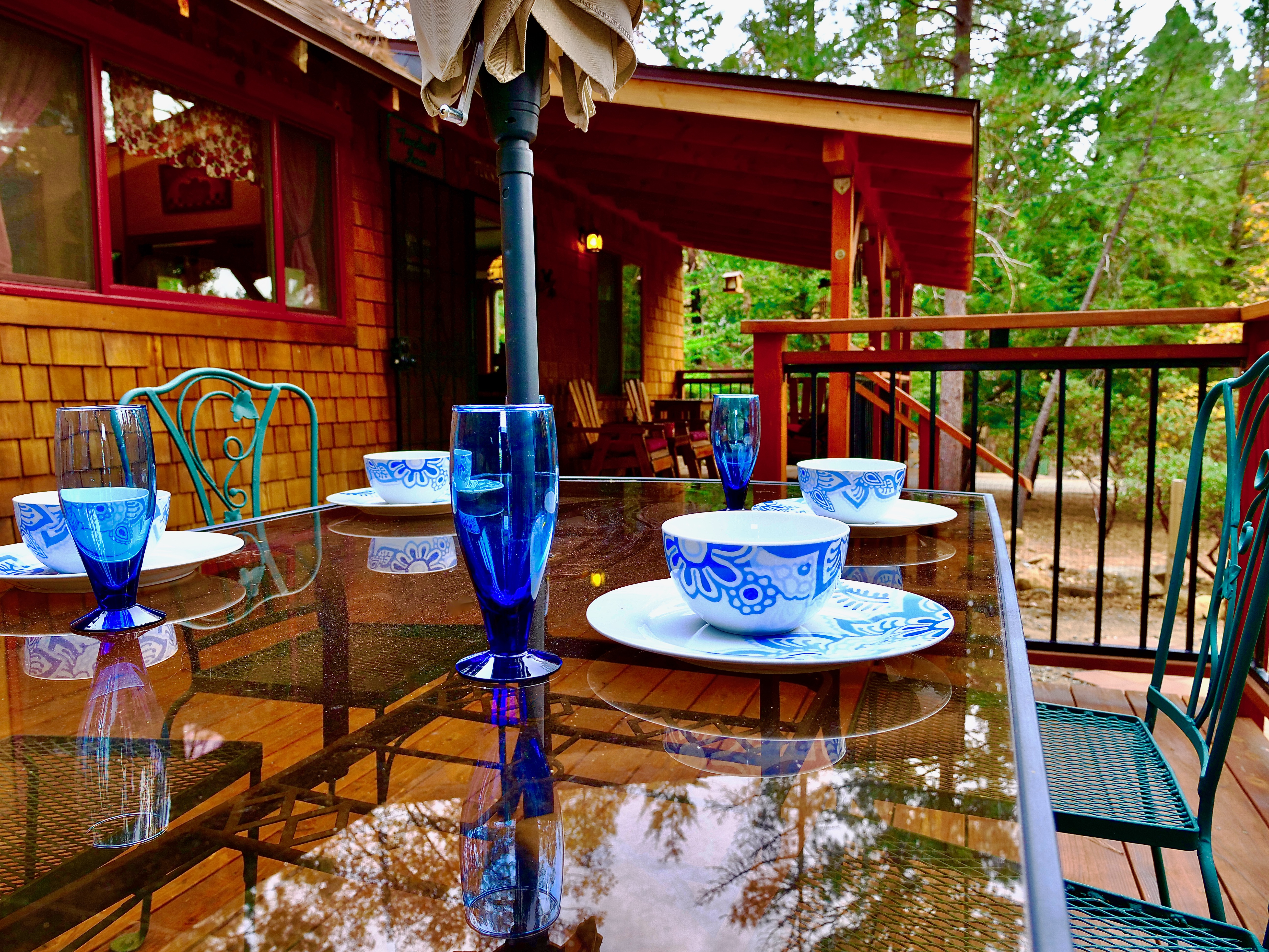 Enjoy dinner al fresco amongst the tall pine trees.-Original