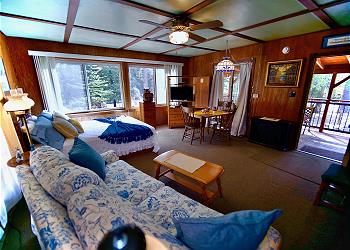 Bedroom with queen bed and pullout couch. 