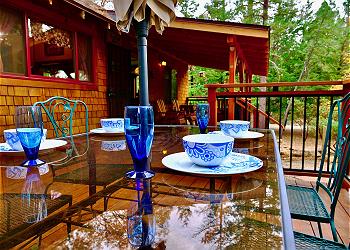 Enjoy dinner al fresco amongst the tall pine trees.