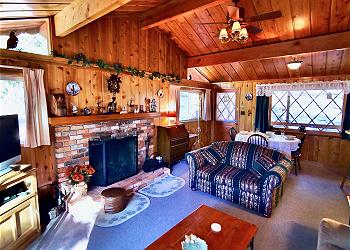  Charming cabin featuring knotty pine accents and vintage mounta