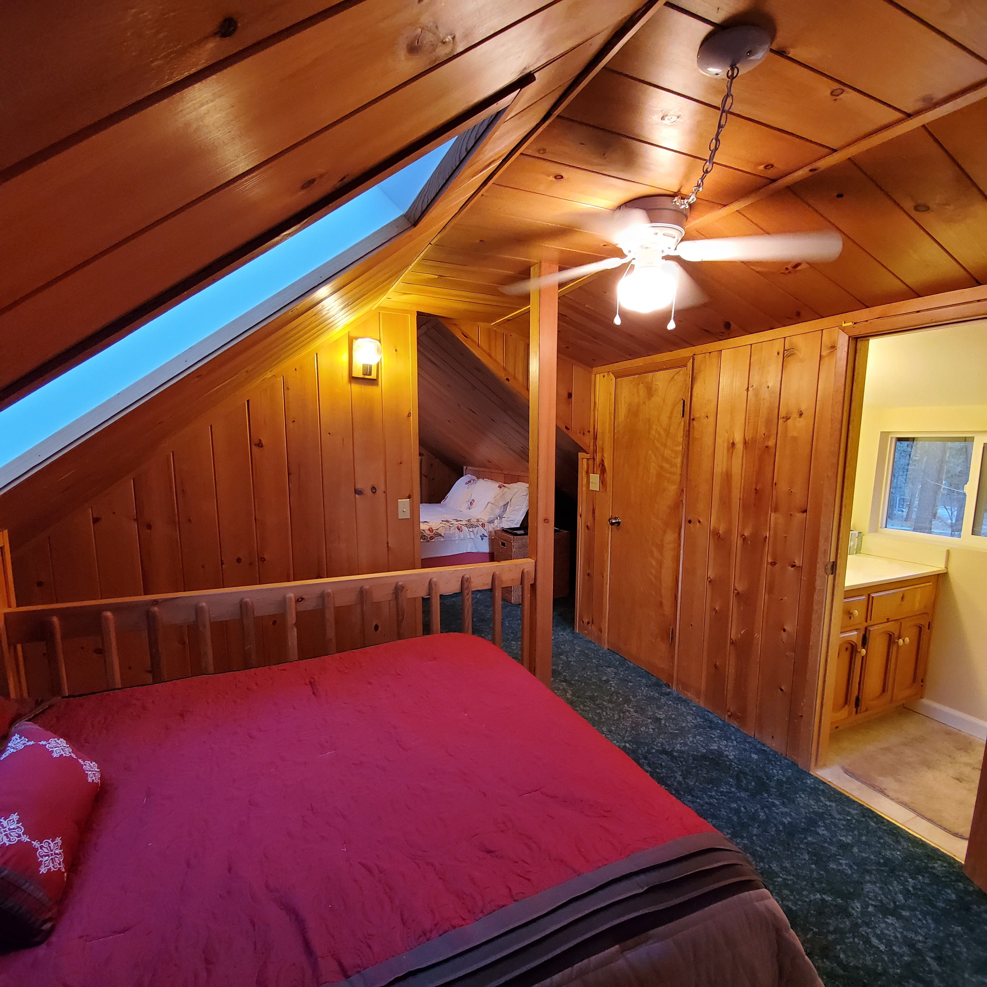 Other side of upstairs loft has double bed and bathroom access.-Original