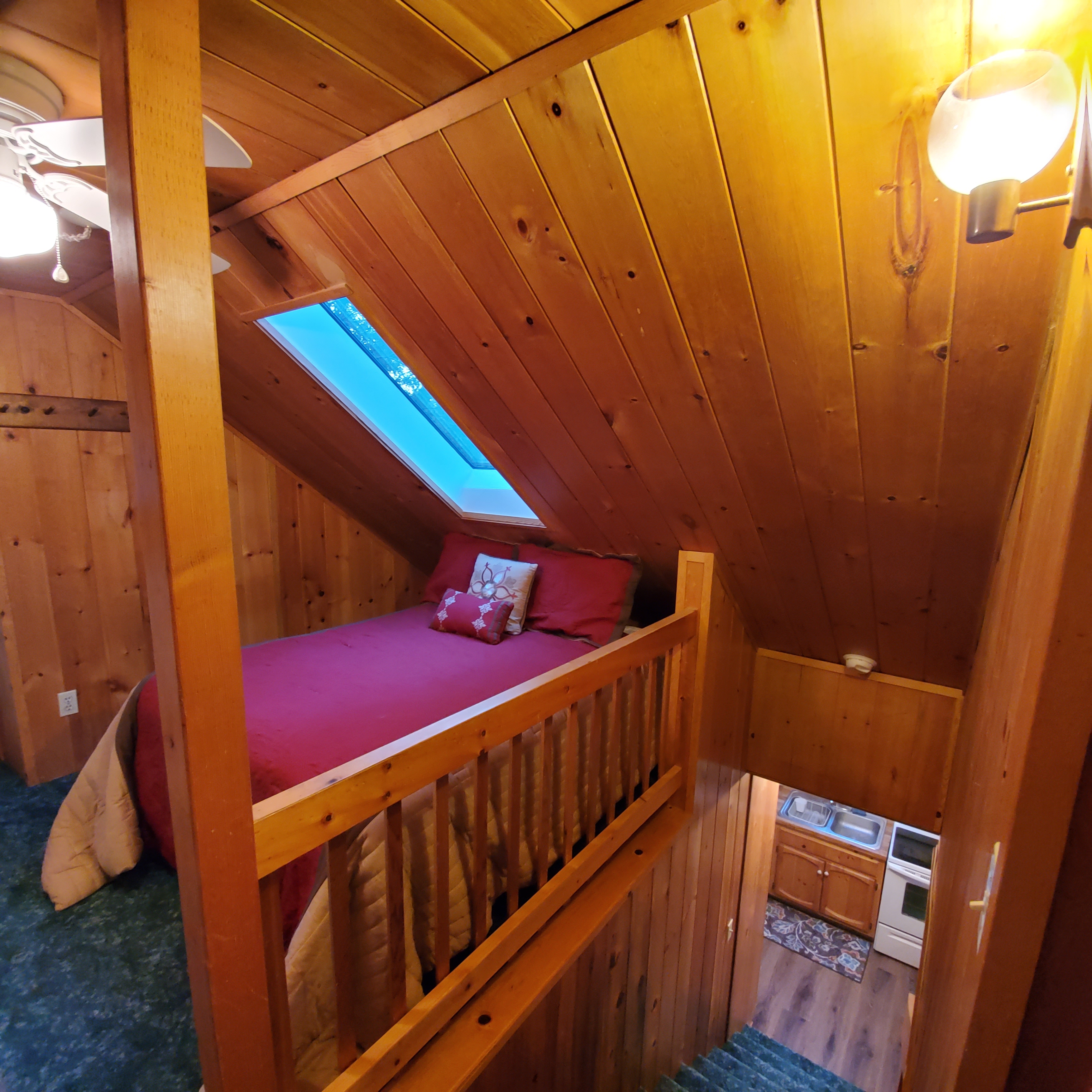 Other side of upstairs loft has double bed and bathroom access.-Original