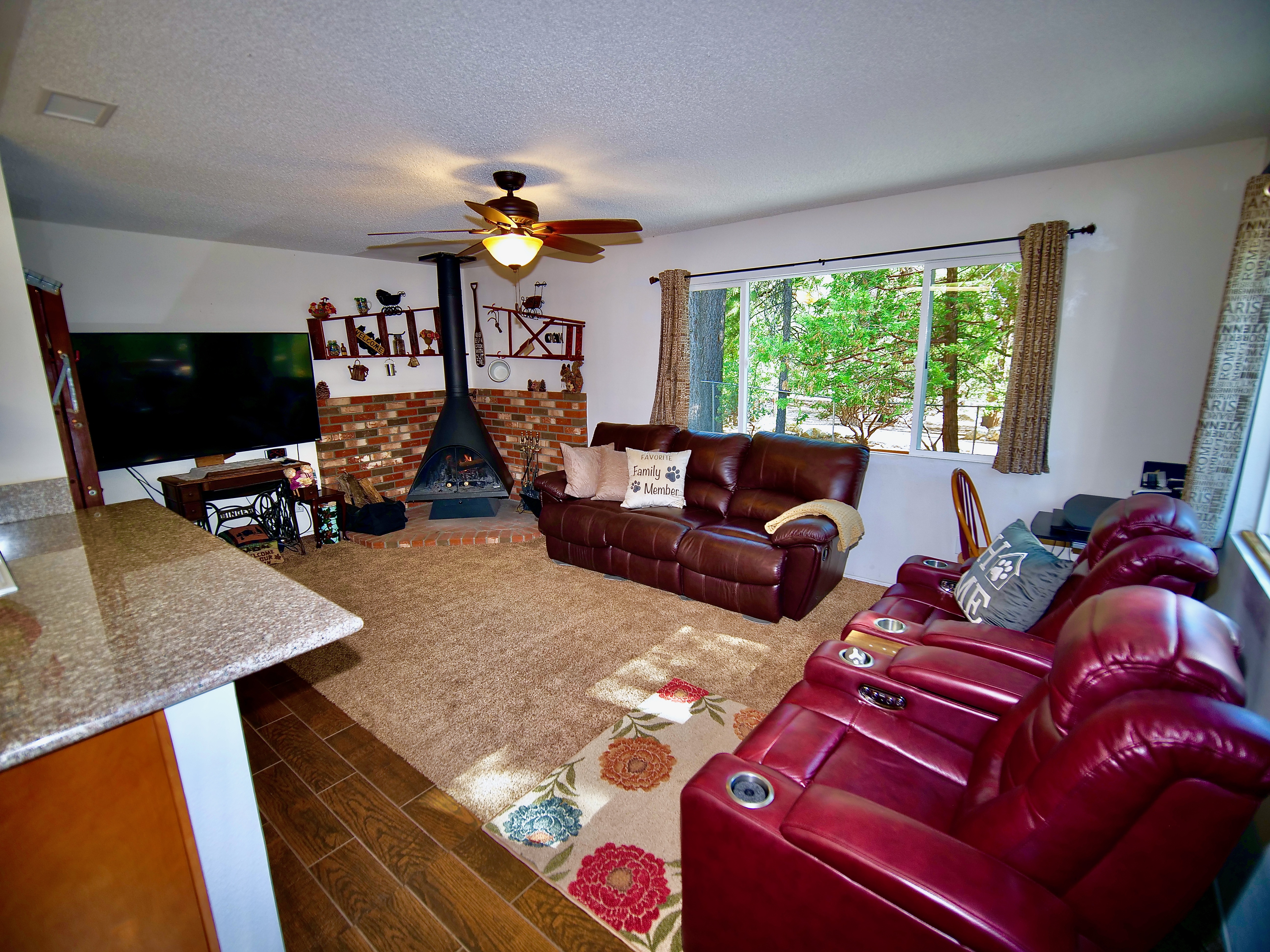 Living room with fireplace and smart TV.-Original