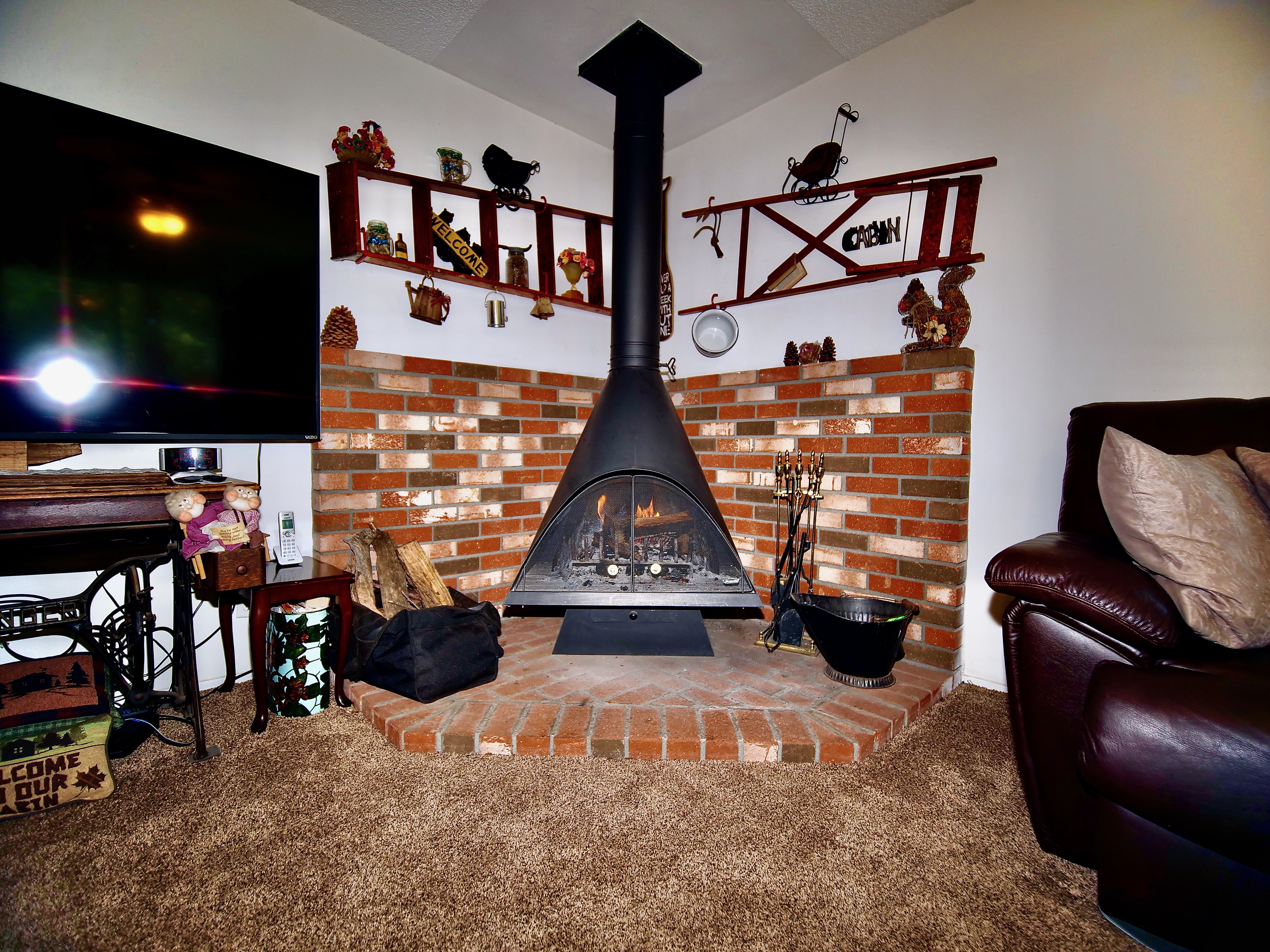 Cozy up by the fireplace in the warm winter months.-Original