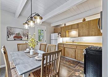 Kitchen is fully equipped and dining table seats up to 6 guests.