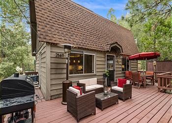 The home's deck features comfortable outdoor seating and propane