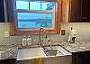 Double farmhouse sink overlooking the lake.