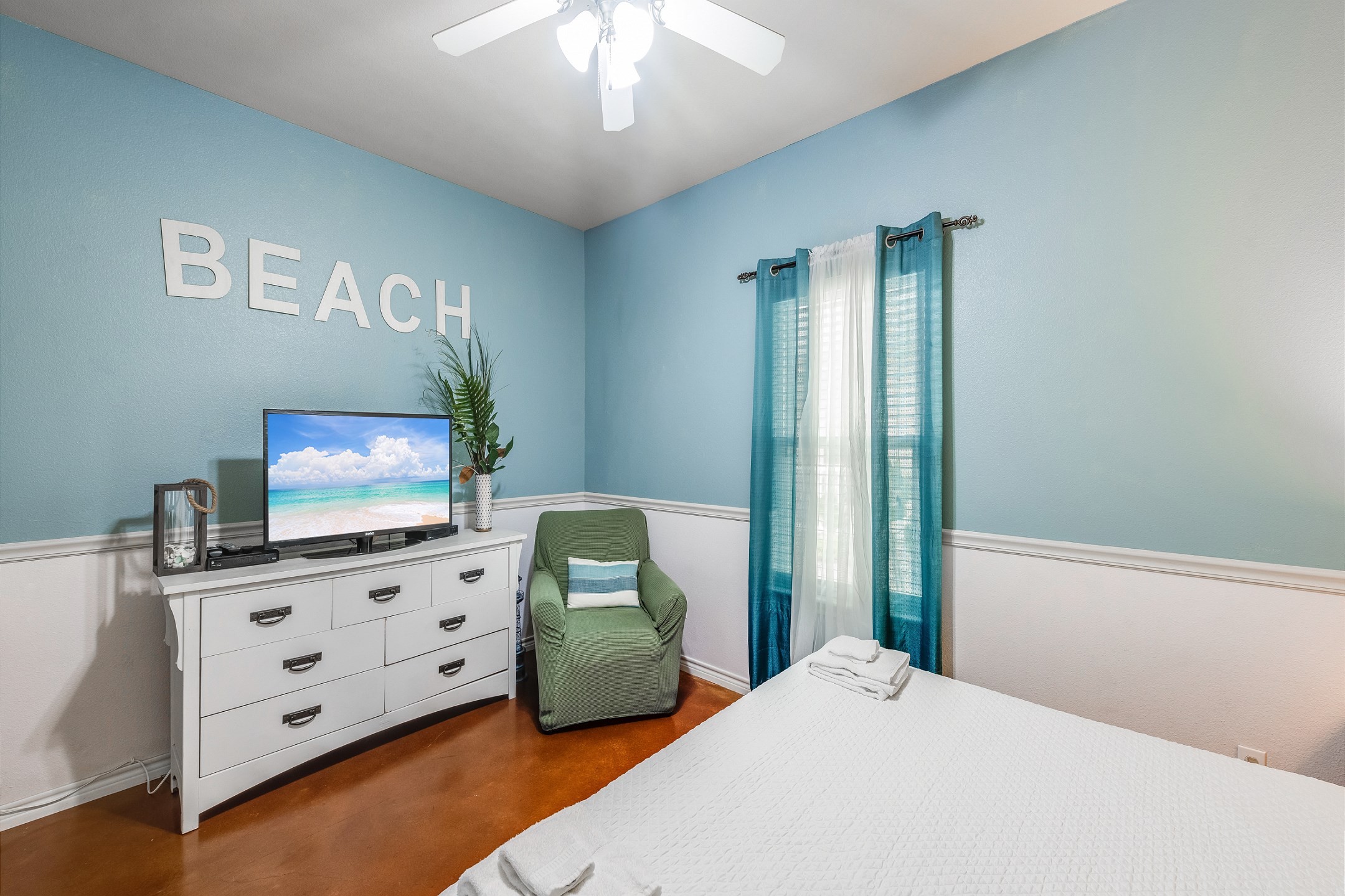 Charming master bedroom with king size bed and flat screen TV to relax on your vacation