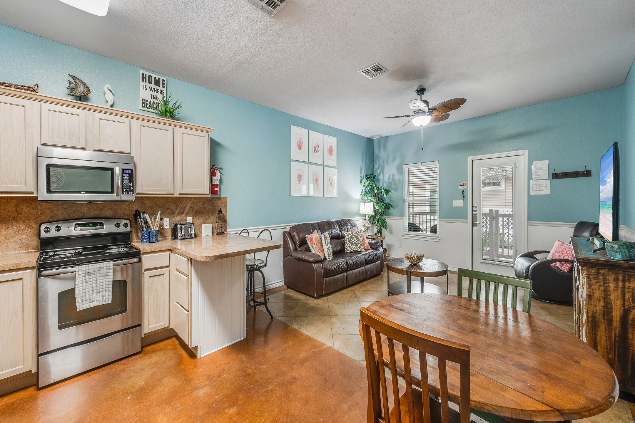 Open concept living, kitchen, and dining area for family gatherings 