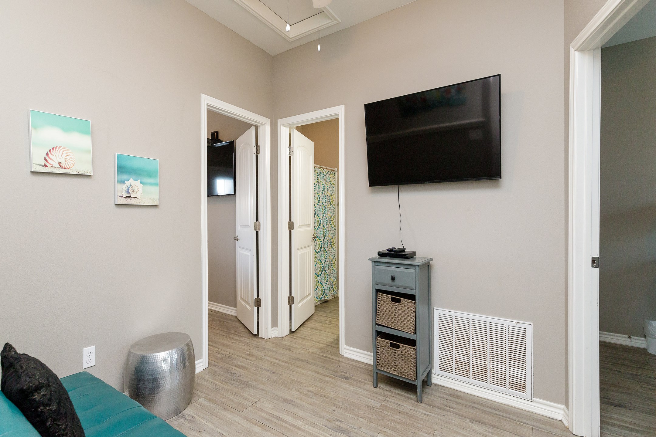Second floor loft/lounge area with a futon and flat screen TV