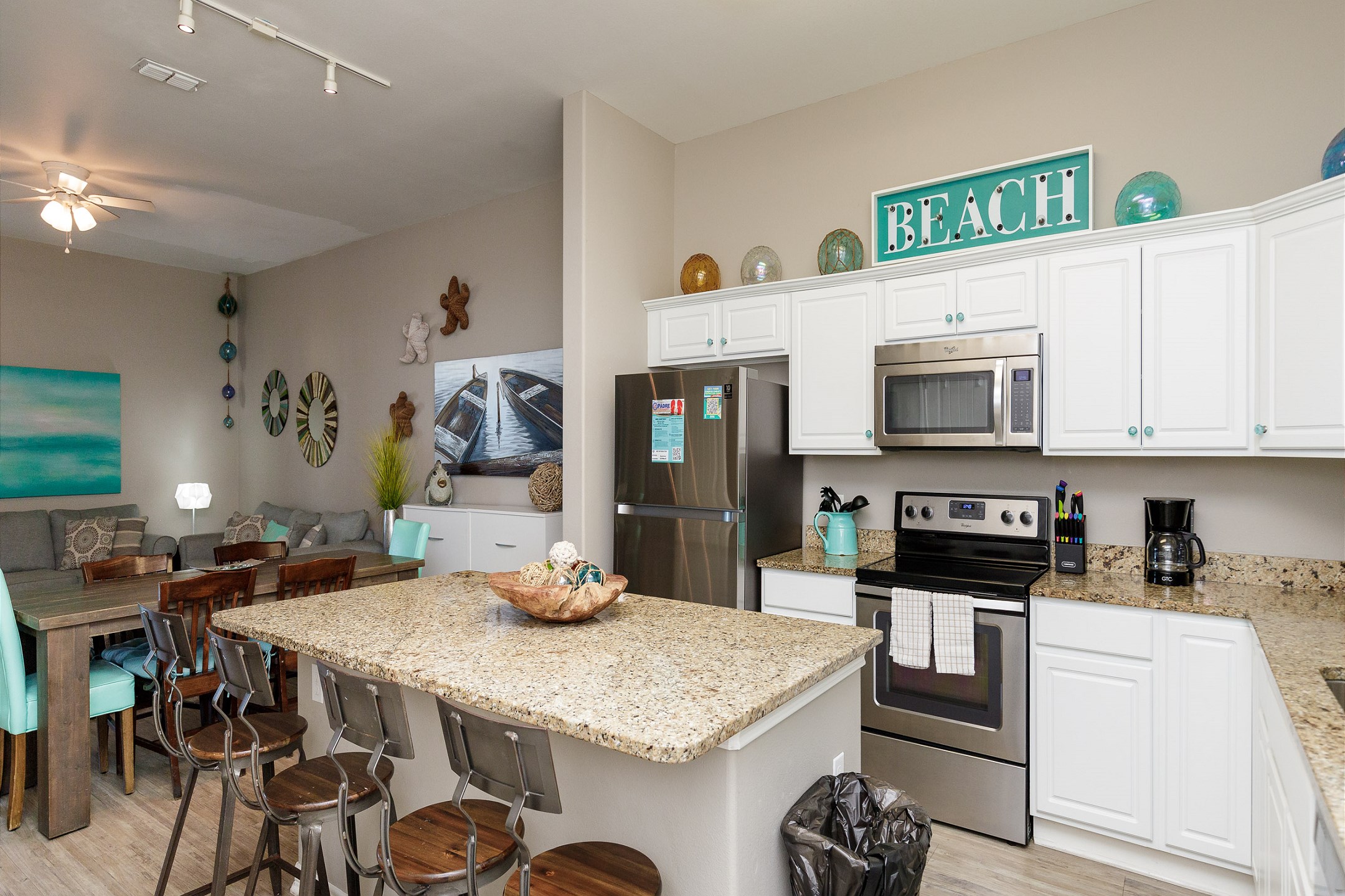 Bright kitchen with granite countertops and plenty of space designed for easy meal preparation