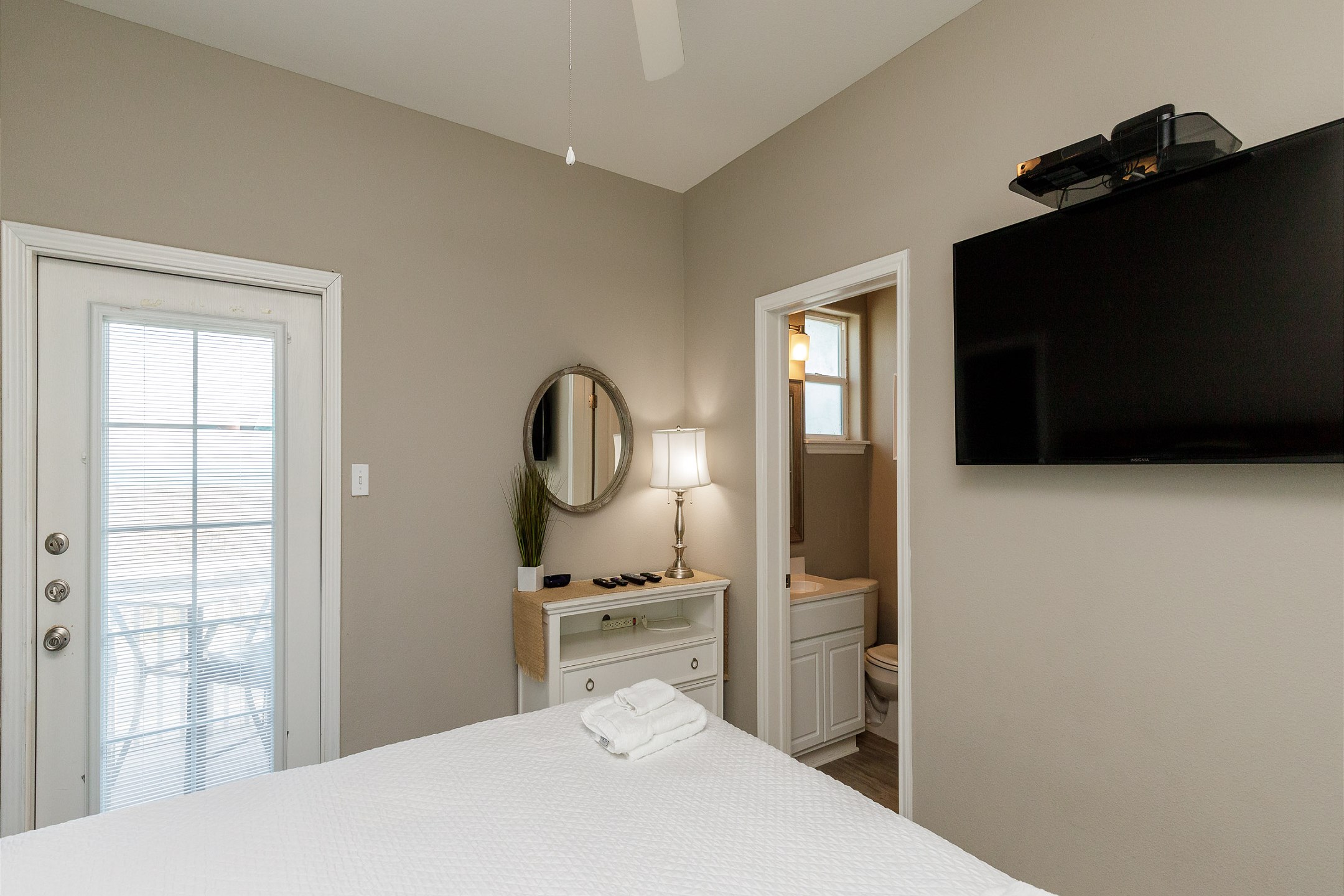 Master bedroom on the second floor with a king size bed, private balcony, ensuite bathroom and flat screen TV 