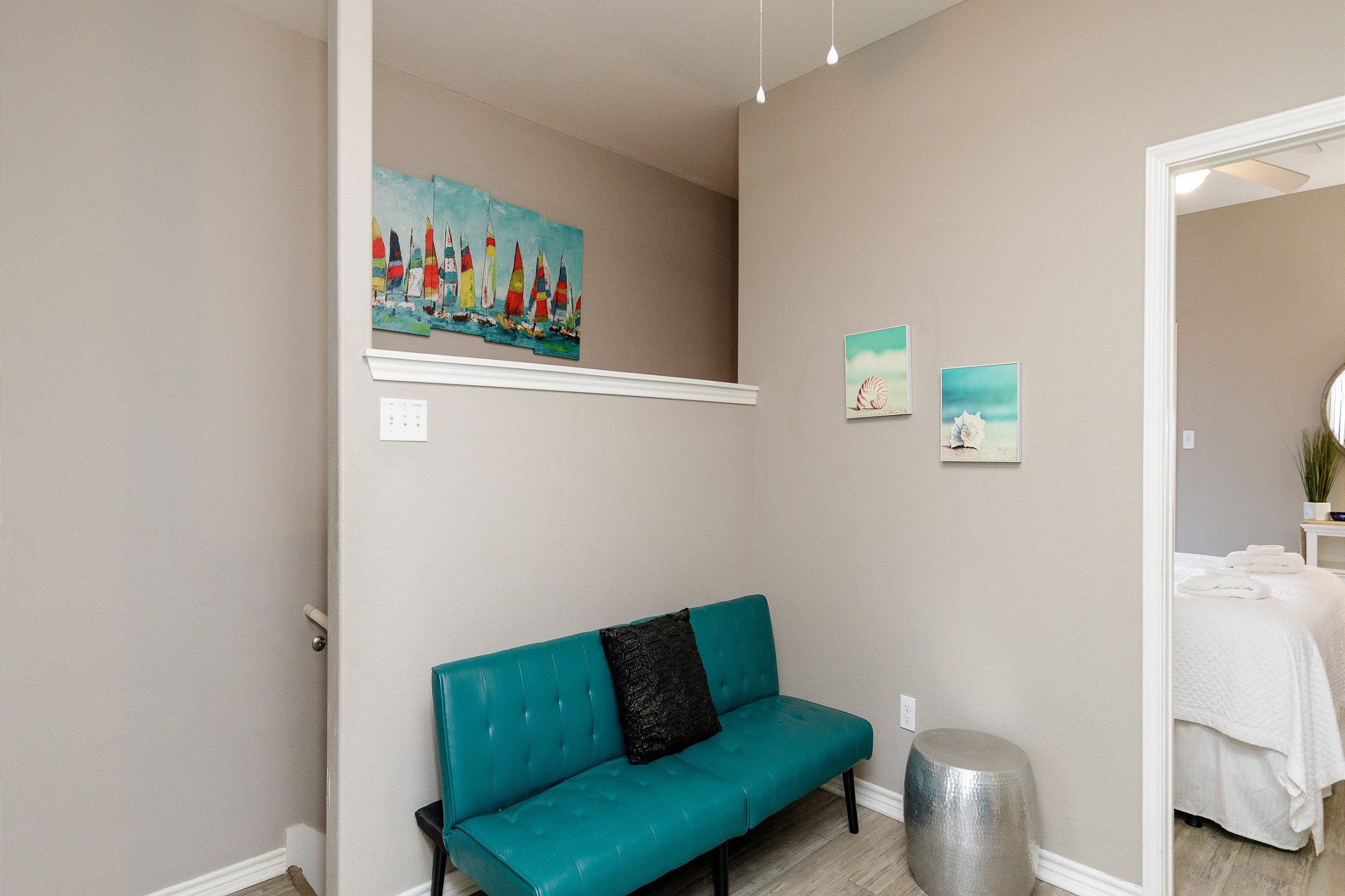 Second floor loft/lounge area with a futon and flat screen TV