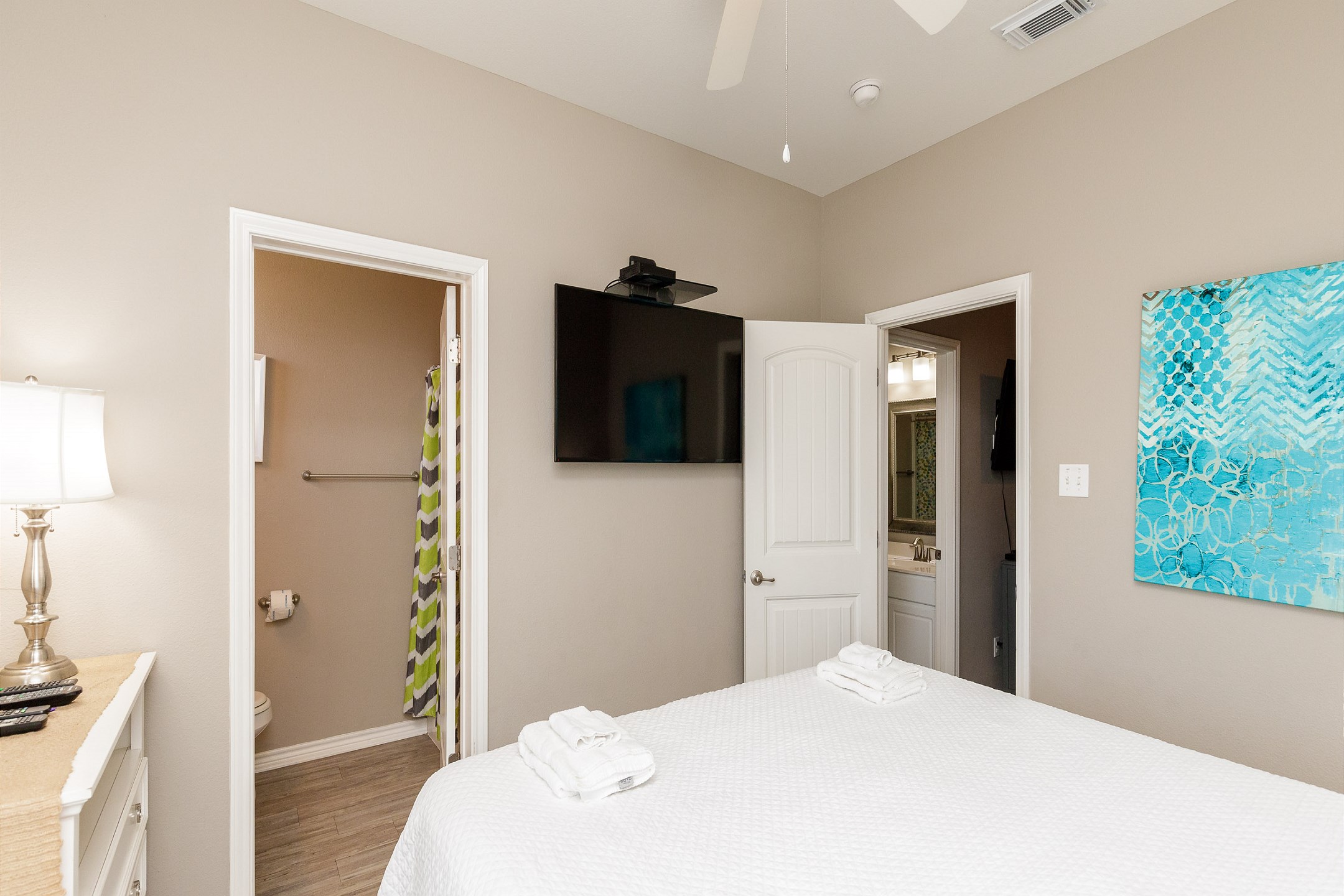 Master bedroom on the second floor with a king size bed, private balcony, ensuite bathroom and flat screen TV 