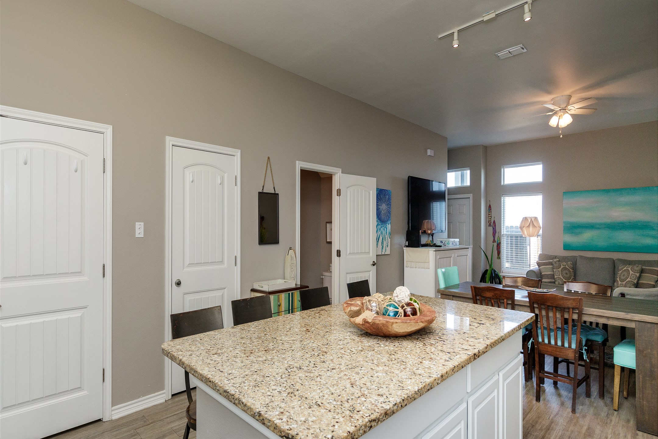 Open-concept layout connecting the dining area to the kitchen