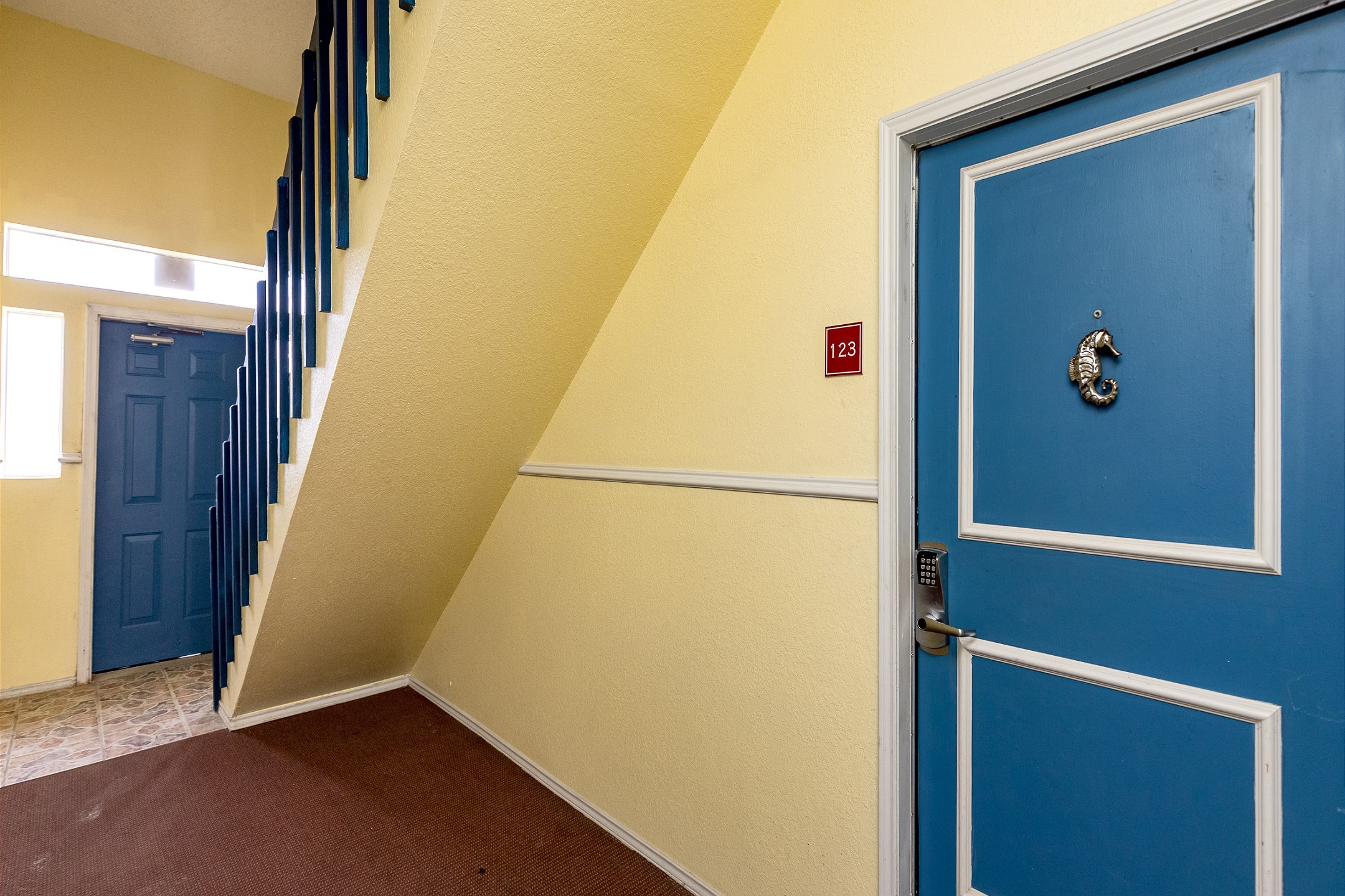 Front door entrance with coded lock for added security 