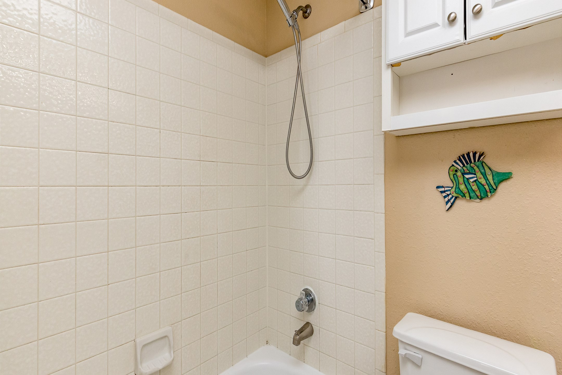 Full bathroom with tub and shower combo