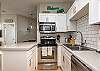 Fully equipped kitchen area with stainless steel appliances 