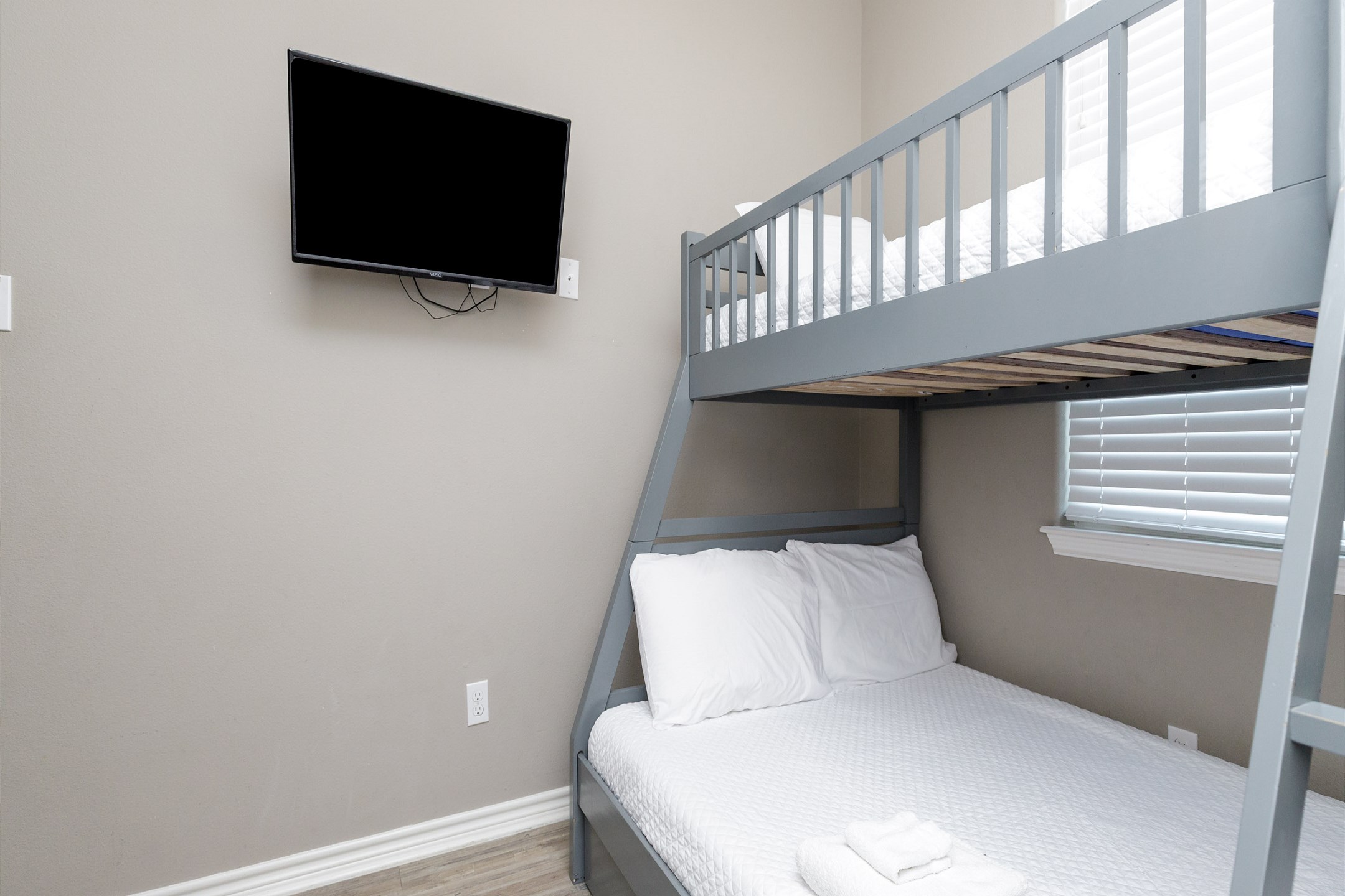 Fourth bedroom on the second floor with twin over full size bunk bed and flat screen TV