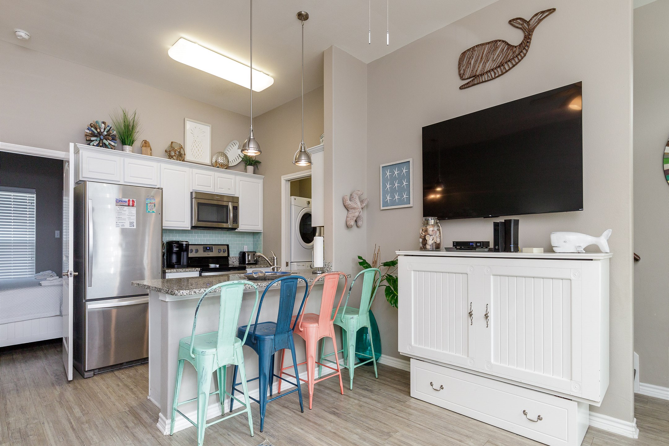 Open-concept layout connecting the kitchen to the dining and living areas