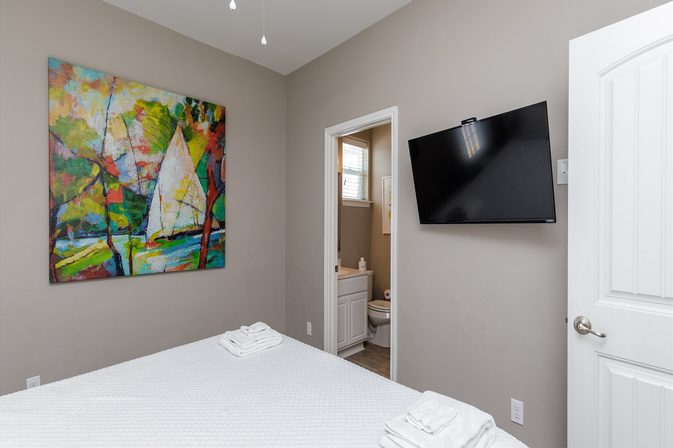 Second bedroom on the second floor with a king size bed, ensuite bathroom, private balcony and flat screen TV 