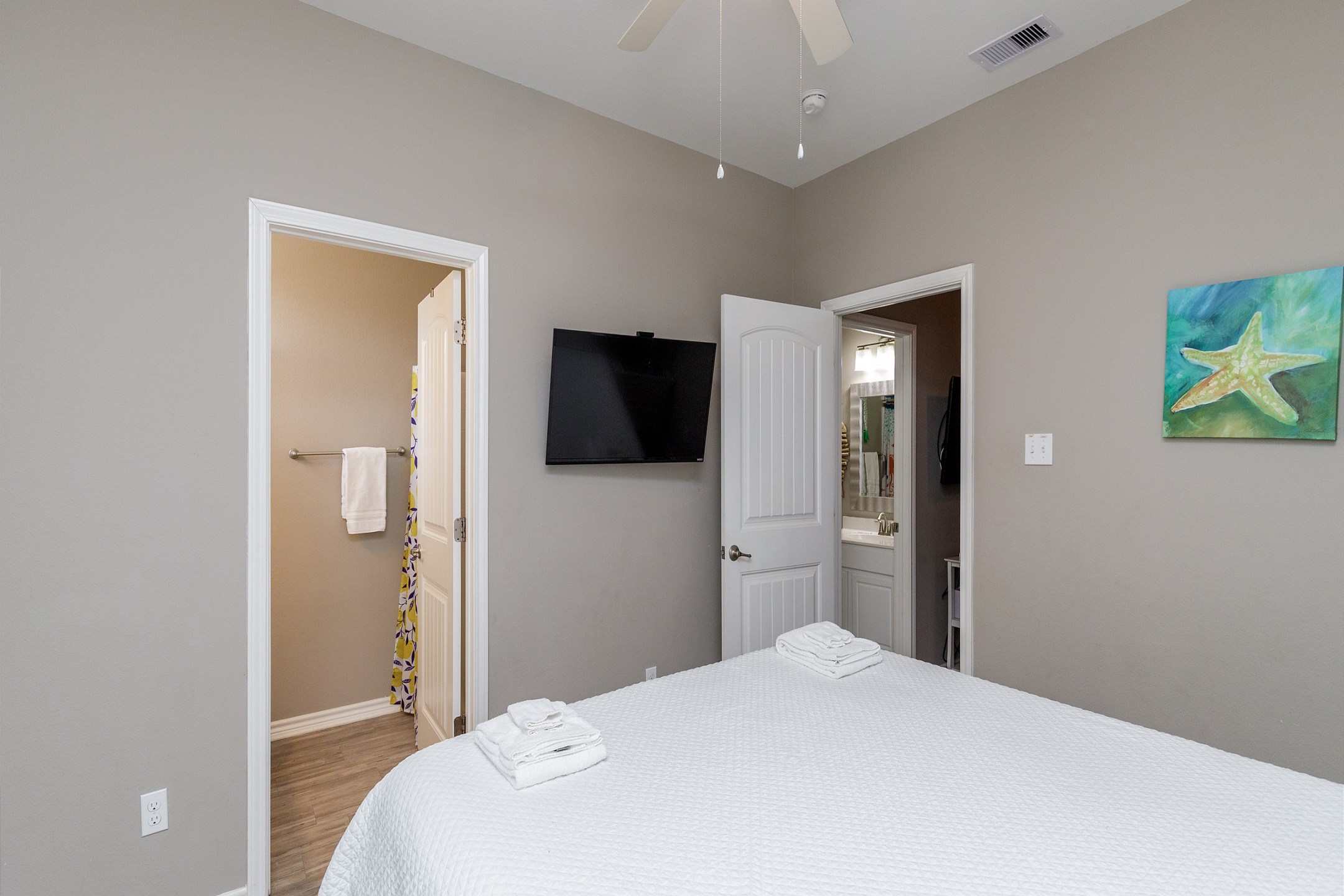 Second bedroom on the second floor with a king size bed, ensuite bathroom, private balcony and flat screen TV 