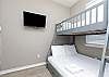 Fourth bedroom on the second floor with twin over full size bunk bed and flat screen TV
