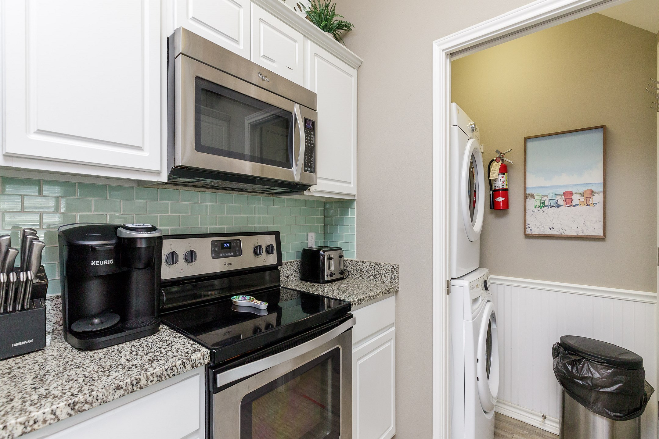 Coffee maker, toaster, cookware, dinnerware, and other kitchen essentials provided