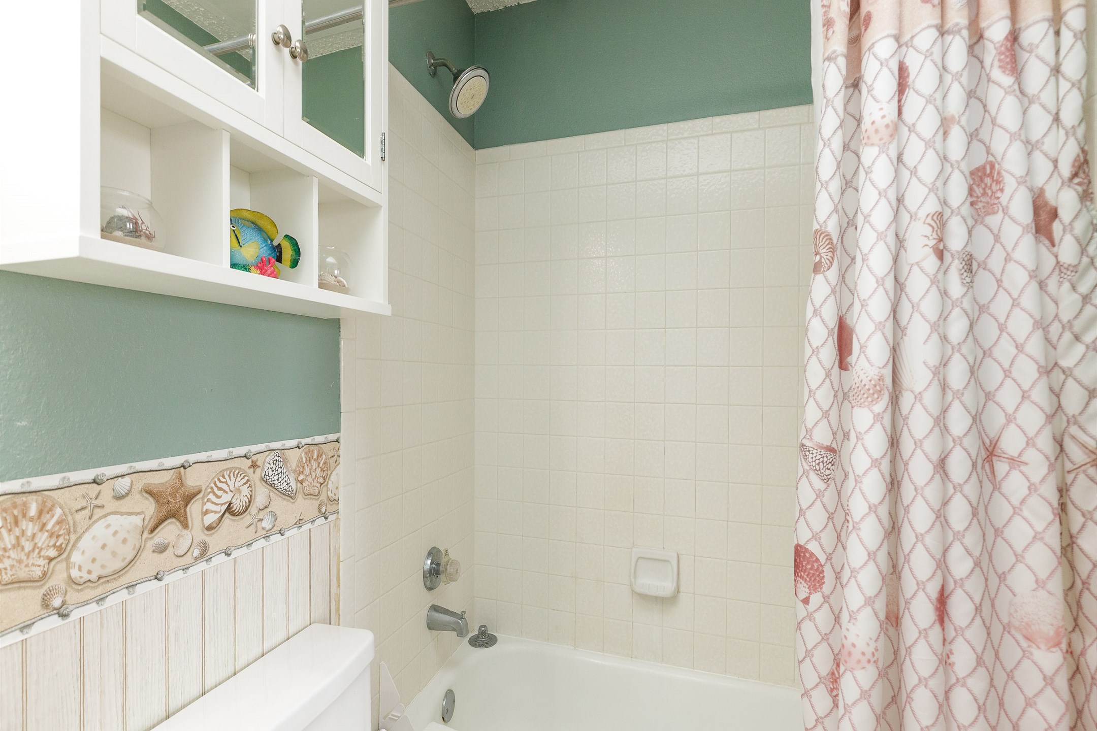Full bathroom with tub and shower combo