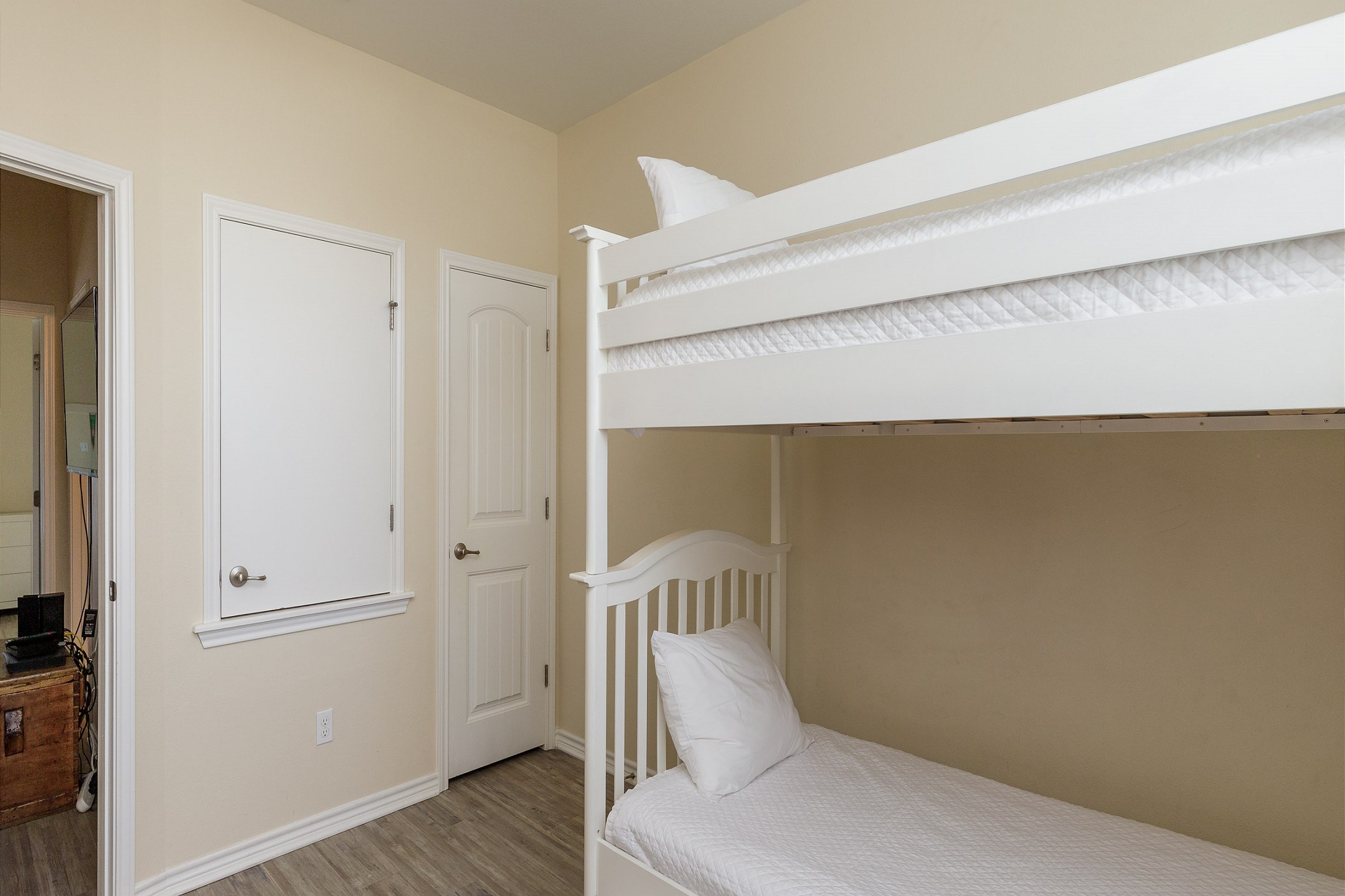 Third bedroom on the second floor with twin size bunk beds and a twin size trundle bed to sleep 3 guests comfortably