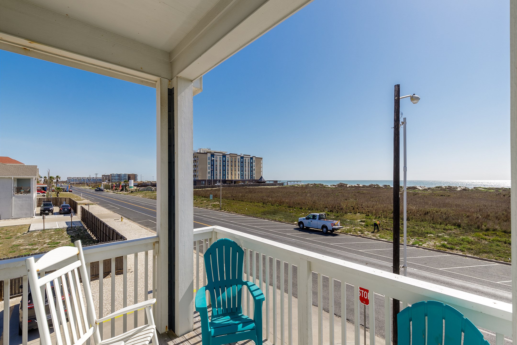 Private balcony off master bedroom with a beach view