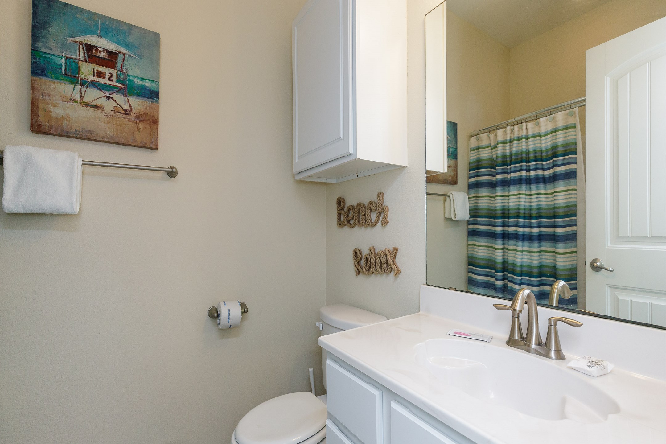 Second floor guest bathroom with tub and shower combo