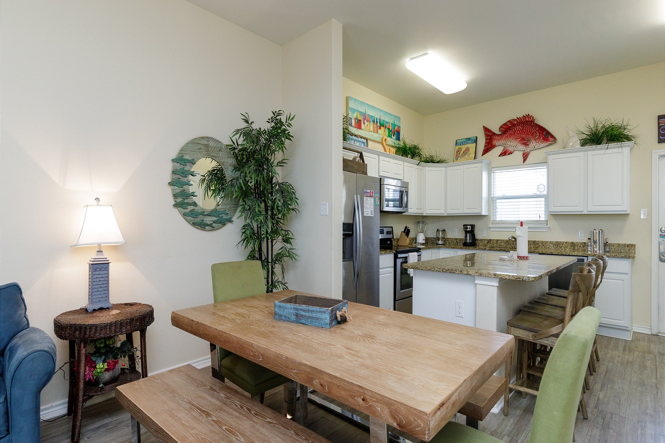 Large dining table with easy access to the well-equipped kitchen, perfect for gatherings