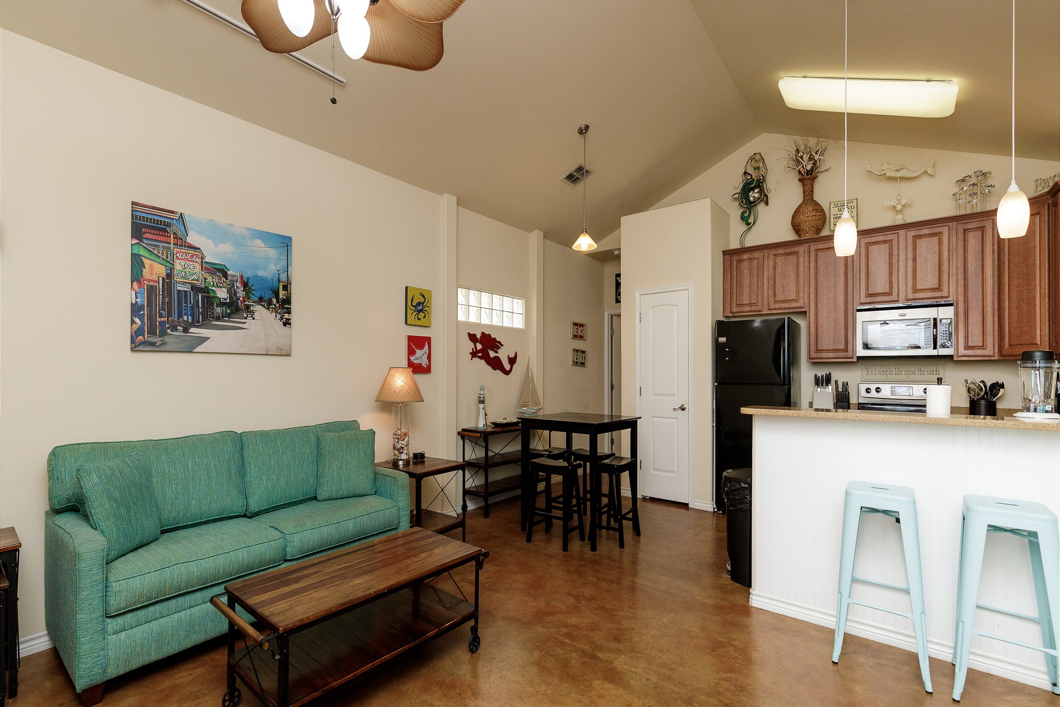 Open concept living, dining, and kitchen space