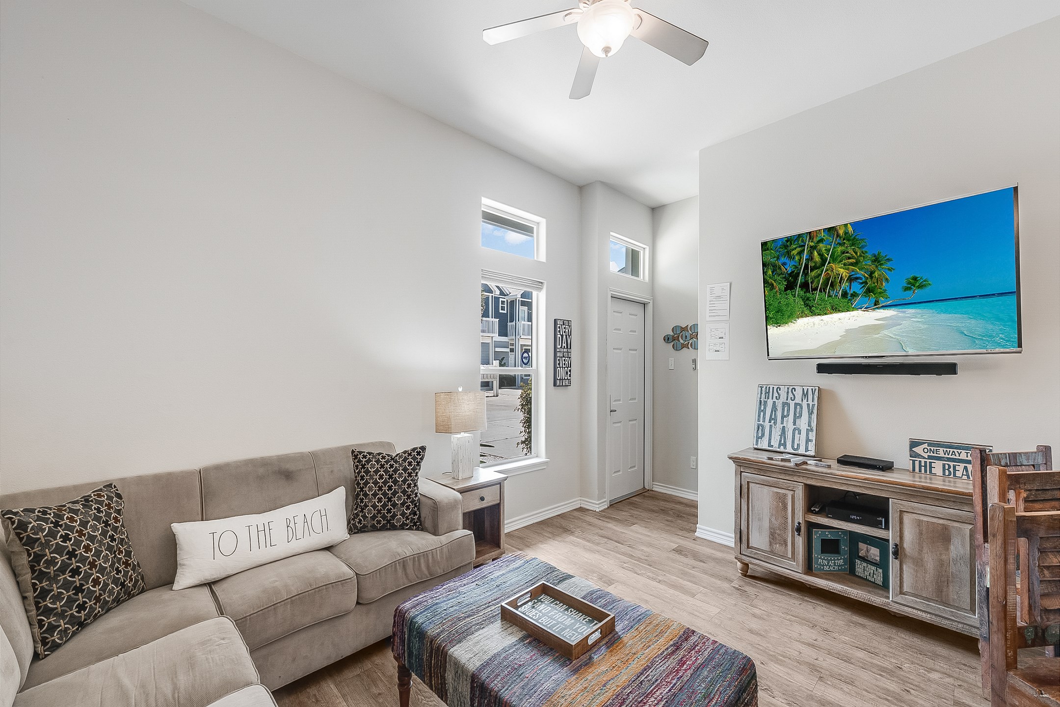 The downstairs living area features an open-concept layout with ship-lap siding that is the perfect place for entertaining or relaxing with family and friends. The large sectional (with pull out queen bed) will be a focal point to watch the 65” smart, fl