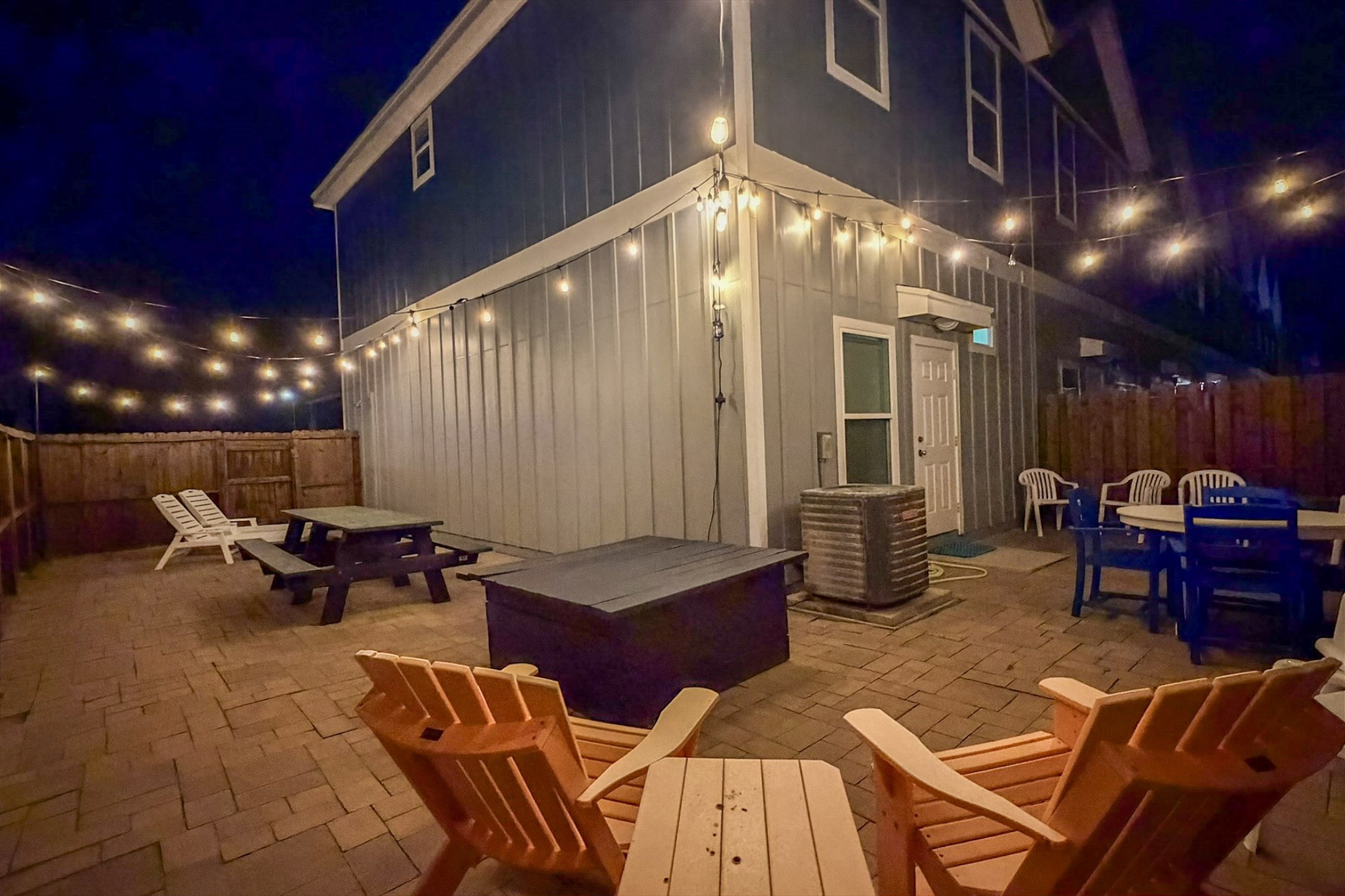 Welcome to your private patio with beautiful string lights to set the mood - a perfect space to relax after a long day